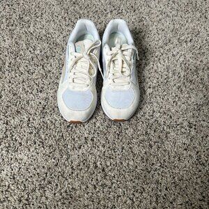 These are Puma Soft Foam sneakers for women in white with blue and beige details